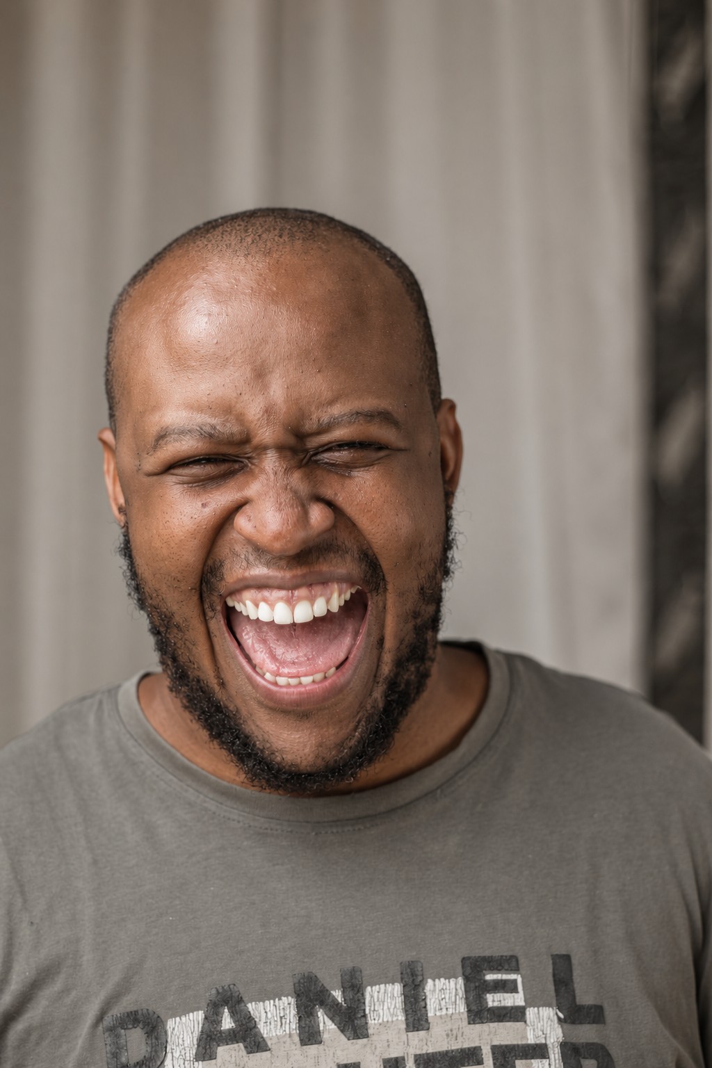 A man laughing freely